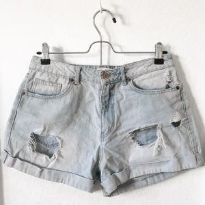 High-waisted distressed denim shorts